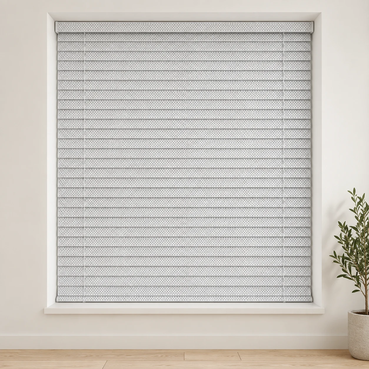 Perforated White shown as a full blind in a neutral room